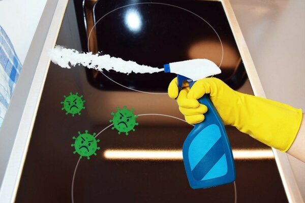 Eine Fotocollage mit einer fotografierten Herdplatte und einer Zeichnung mit einer Sprühflasche und Viren