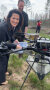 Ministerin Kaniber befüllt eine Drohne mit Saatgut
